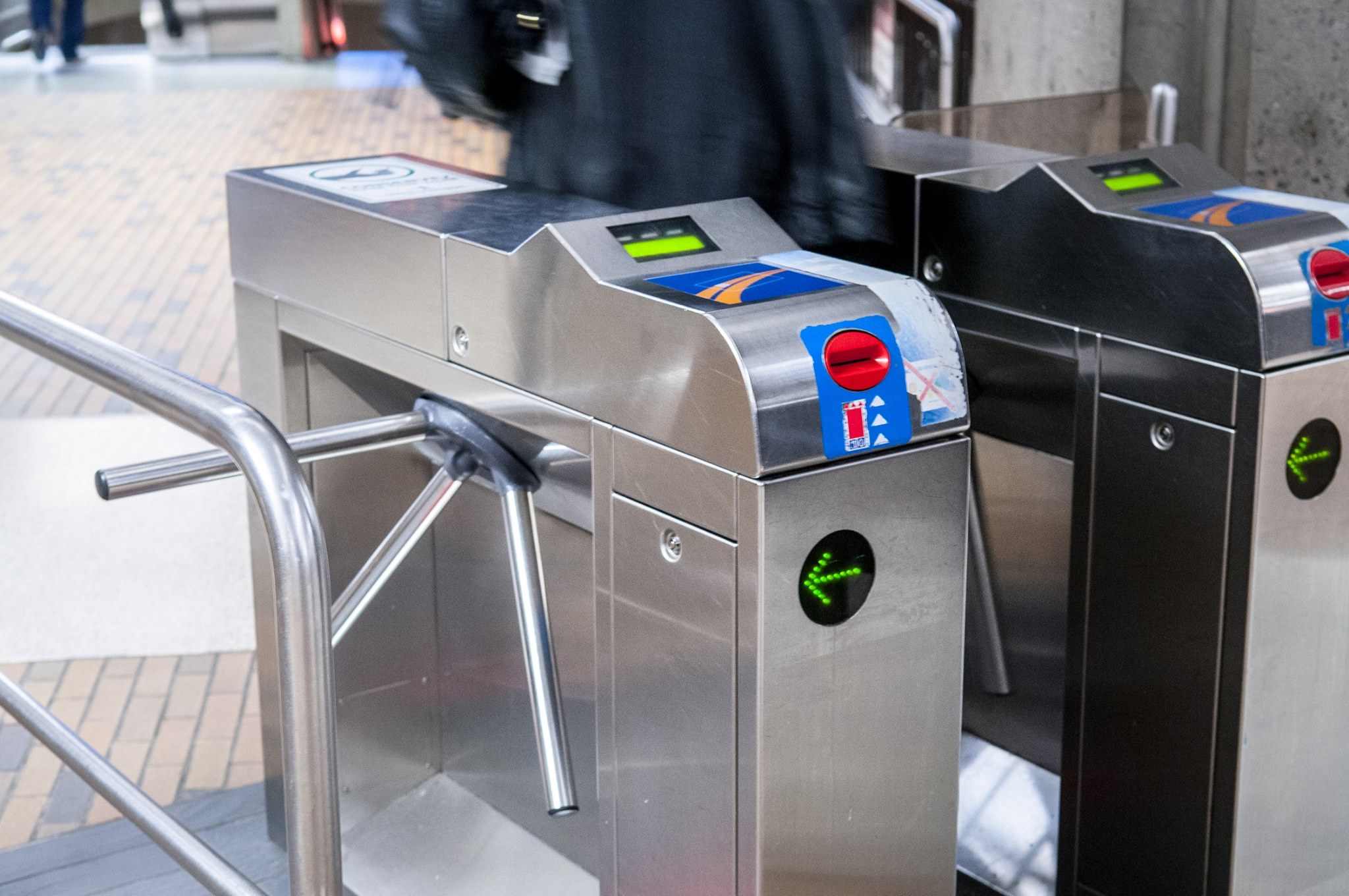 Montréal turnstiles, with a card reader on the top, and an ATM-like card insertion slot on the front side.